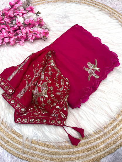 A luxurious Rani pink space silk saree featuring ornate silver bird motifs and scattered sequin detailing. The saree includes a matching stitched blouse with intricate zari and sequin embroidery, ideal for weddings and grand celebrations.