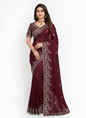 A maroon Fandy silk saree beautifully adorned with delicate floral embroidery and shimmering silver threadwork. The saree includes a matching blouse with coordinated embroidery, ideal for festive and formal occasions.
