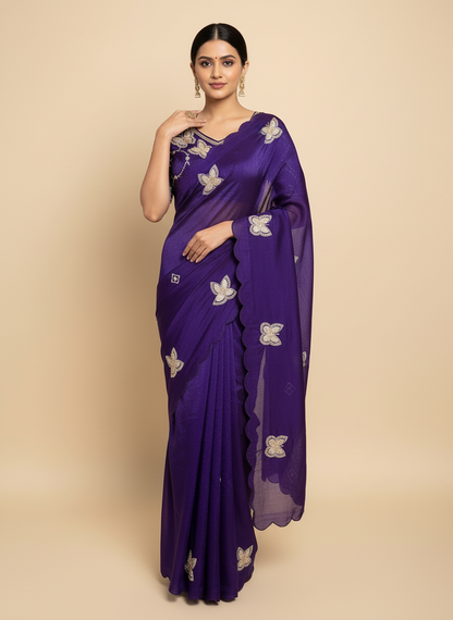 A luxurious purple space silk saree adorned with golden butterfly embroidery and scalloped edges. The saree is paired with a matching stitched blouse featuring circular sequin patterns and butterfly designs, perfect for festive and party occasions.